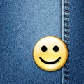 Happy smiley face badge on blue denim Royalty Free Stock Photo