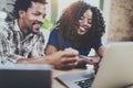 Happy smiling african american couple working together at home.Young black man and his girlfriend using laptop at home Royalty Free Stock Photo