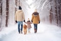 Happy smiling African American family - father and daughter, walking their pet golden retriever in the winter forest Royalty Free Stock Photo