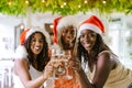 Happy smiling African American girls celebrating Christmas or new year Royalty Free Stock Photo