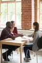 Young multiethnic couple shaking hands with real estate agent. Royalty Free Stock Photo