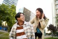 Happy smiling asian couple having fun and looking at each other. Young lovers making holidays. Youth culture Royalty Free Stock Photo