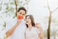 Happy smiling Asian couple in love at park Royalty Free Stock Photo