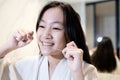 Happy smiling asian girl flossing her teeth,clean her healthy teeth before going to bed at night,beautiful child girl brushing Royalty Free Stock Photo