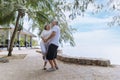 Happy and smiling asian senior retired couple, elder man and woman enjoying with retired vacation at sea beach outdoor. Health Royalty Free Stock Photo