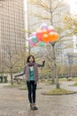 Happy smiling Asian woman holding balloons Royalty Free Stock Photo