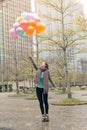 Happy smiling Asian woman holding balloons Royalty Free Stock Photo