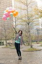 Happy smiling Asian woman holding balloons Royalty Free Stock Photo