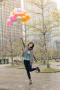 Happy smiling Asian woman holding balloons Royalty Free Stock Photo