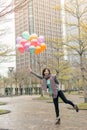Happy smiling Asian woman holding balloons Royalty Free Stock Photo