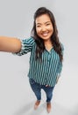 Happy smiling asian woman taking selfie Royalty Free Stock Photo