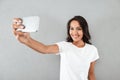 Happy smiling asian woman taking selfie Royalty Free Stock Photo