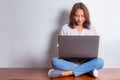 Happy smiling asian woman working on laptop Royalty Free Stock Photo