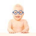 Happy smiling baby in glasses.