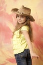 Happy smiling baby wearing a cow girl outfit with hat Royalty Free Stock Photo