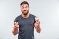 Happy smiling bearded man eating cream cake Royalty Free Stock Photo
