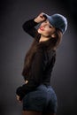 Happy smiling beautiful brunette woman in baseball blue cap with Royalty Free Stock Photo