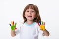 Happy smiling beautiful little girl with her colorful hands in the paint isolated on white background Royalty Free Stock Photo