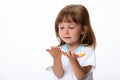 Happy smiling beautiful little girl with her colorful hands in the paint isolated on white background Royalty Free Stock Photo