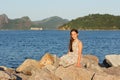 Happy smiling beautiful teen girl in dress with long brown hair Royalty Free Stock Photo