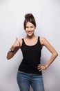 Happy smiling beautiful young brunette woman showing thumbs up gesture, isolated on white background. Royalty Free Stock Photo