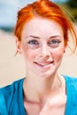 Happy smiling beautiful young redhead woman