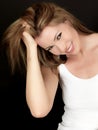 Happy Smiling Beautiful Young Woman Playing with Hair Royalty Free Stock Photo