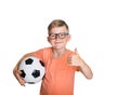 Happy smiling blond child boy in pink T-shirt with soccer ball showing thumb up isolated on white background. Winner kid Royalty Free Stock Photo