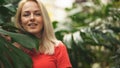 Blonde woman in tropical forest