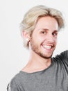 Happy smiling blonde man in grey t shirt Royalty Free Stock Photo