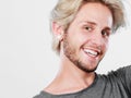 Happy smiling blonde man in grey t shirt Royalty Free Stock Photo