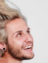 Happy smiling blonde man with windblown hair Royalty Free Stock Photo