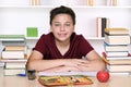 Happy smiling boy doing homework at school Royalty Free Stock Photo