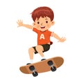 Happy smiling boy has a good time riding on a skateboard Royalty Free Stock Photo