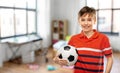 happy smiling boy holding soccer ball at home Royalty Free Stock Photo