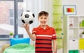 happy smiling boy holding soccer ball at home Royalty Free Stock Photo