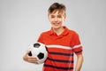 Happy smiling boy holding soccer ball Royalty Free Stock Photo