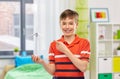 happy smiling boy holding toy wind turbine at home Royalty Free Stock Photo