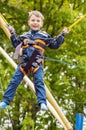 Happy smiling boy is jumping on trampoline Royalty Free Stock Photo