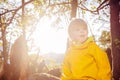 Happy smiling boy portrait in autumn sunny forest Royalty Free Stock Photo