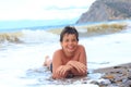 Happy smiling boy on the sea beach Royalty Free Stock Photo