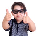 Happy smiling boy in sunglasses showing thumbs up gesture, close Royalty Free Stock Photo