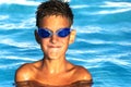 Happy smiling boy in water glasses in the pool. close-up portreit Royalty Free Stock Photo