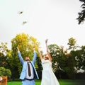 Happy smiling bride and groom hands releasing white doves on a s Royalty Free Stock Photo