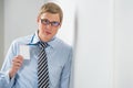 Happy smiling business man in glasses showing blank badge Royalty Free Stock Photo