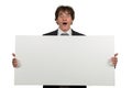 Happy smiling business man showing blank signboard, isolated over white background Royalty Free Stock Photo