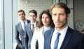 Happy smiling business team standing in a row at office. Royalty Free Stock Photo