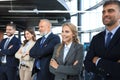 Happy smiling business team standing in a row at office Royalty Free Stock Photo