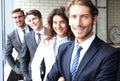 Happy smiling business team standing in a row at office. Royalty Free Stock Photo