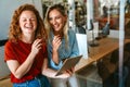 Happy smiling business women working together online on a tablet in office Royalty Free Stock Photo